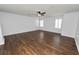 Bright bedroom featuring hardwood floors and a ceiling fan at 3537 Julius Estates Blvd, Winter Haven, FL 33881