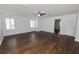 Spacious bedroom with dark hardwood floors and ceiling fan at 3537 Julius Estates Blvd, Winter Haven, FL 33881