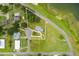 Aerial view showcasing a home's location on a lot near the lake at 405 W 4Th Ct, Frostproof, FL 33843