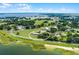 Aerial view of a single-story home with lake access and spacious lot at 405 W 4Th Ct, Frostproof, FL 33843