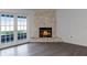 Cozy stone fireplace with adjacent French doors leading outdoors at 405 W 4Th Ct, Frostproof, FL 33843