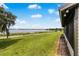 Peaceful lakefront property with lush green landscape at 405 W 4Th Ct, Frostproof, FL 33843