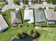 Three homes and a pond view from above at 4104 Martindale Loop, Winter Haven, FL 33884