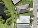 Home's bird's eye view showcasing backyard and pond at 4104 Martindale Loop, Winter Haven, FL 33884