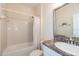 Clean bathroom with tub shower and granite vanity at 4104 Martindale Loop, Winter Haven, FL 33884