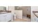 Bathroom boasts a walk-in shower and double vanity at 4104 Martindale Loop, Winter Haven, FL 33884