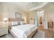 Bright bedroom with a queen-size bed and ensuite bathroom access at 4104 Martindale Loop, Winter Haven, FL 33884