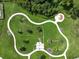 Overhead view of a community dog park with a winding path at 4104 Martindale Loop, Winter Haven, FL 33884