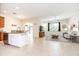 Open concept kitchen and living area with tile flooring at 4104 Martindale Loop, Winter Haven, FL 33884