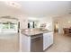 Open-concept kitchen with granite countertops, stainless steel appliances, flowing into a dining area at 4104 Martindale Loop, Winter Haven, FL 33884