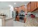 Kitchen with stainless steel appliances and granite countertops at 4104 Martindale Loop, Winter Haven, FL 33884