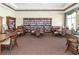 Community library with ample seating and extensive collection of books at 4104 Martindale Loop, Winter Haven, FL 33884