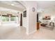 Open living room and sunroom with neutral color palette and tile flooring at 4104 Martindale Loop, Winter Haven, FL 33884