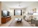 Living room featuring a comfy chair and flat-screen TV at 4104 Martindale Loop, Winter Haven, FL 33884