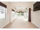 Bright sunroom filled with windows and a ceiling fan, perfect for relaxing or entertaining at 4104 Martindale Loop, Winter Haven, FL 33884