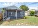 House exterior featuring a covered patio and fenced backyard at 752 Hunt Dr, Lake Wales, FL 33853