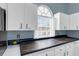 Kitchen with dark wood countertop and white cabinets at 752 Hunt Dr, Lake Wales, FL 33853