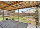 Covered patio with gray composite decking, overlooking backyard at 752 Hunt Dr, Lake Wales, FL 33853