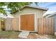 Large storage shed with double doors and wooden ramp at 752 Hunt Dr, Lake Wales, FL 33853