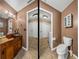 Bathroom split-image featuring a rustic vanity and a separate toilet area for added privacy at 3808 Gaines Dr, Winter Haven, FL 33884