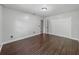 Bare bedroom featuring hardwood floors, closet doors, and neutral walls that provide a blank canvas at 3808 Gaines Dr, Winter Haven, FL 33884