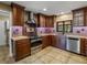 Well-lit kitchen with stainless steel appliances and granite countertops for a touch of luxury at 3808 Gaines Dr, Winter Haven, FL 33884