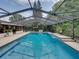 A stunning pool with a screen enclosure provides a private and relaxing outdoor space at 3808 Gaines Dr, Winter Haven, FL 33884