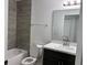 Modern bathroom with gray tile and vanity at 833 3Rd Ave, Waverly, FL 33877