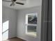 Spacious bedroom with large window and ceiling fan at 833 3Rd Ave, Waverly, FL 33877