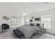 Serene main bedroom featuring stylish furnishings and decor. 'THIS IMAGE IS VIRTUALLY STAGED' at 142 Morning Glory Cir, Winter Haven, FL 33884
