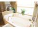 Relaxing bathroom with garden tub and updated fixtures at 3832 Traditions N Blvd, Winter Haven, FL 33884