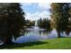 Serene community pond with a central fountain at 3832 Traditions N Blvd, Winter Haven, FL 33884