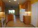 Kitchen with wood cabinets, granite countertops and white appliances at 3832 Traditions N Blvd, Winter Haven, FL 33884