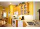 Kitchen features light wood cabinets, double sink, and ample counter space at 3832 Traditions N Blvd, Winter Haven, FL 33884