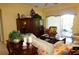 Spacious living room with large windows and an entertainment center at 3832 Traditions N Blvd, Winter Haven, FL 33884