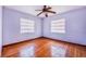 Bright bedroom with hardwood floors and two windows at 605 Florida Ave, Dundee, FL 33838
