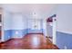 Dining area with hardwood floors and light blue painted walls at 605 Florida Ave, Dundee, FL 33838