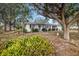Ranch-style home with mature landscaping and a spacious front yard at 605 Florida Ave, Dundee, FL 33838