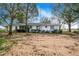 View of the back of the house and yard at 605 Florida Ave, Dundee, FL 33838