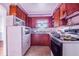 Galley-style kitchen with wood cabinets and a microwave at 605 Florida Ave, Dundee, FL 33838