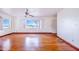 Living room featuring hardwood floors and a large window at 605 Florida Ave, Dundee, FL 33838