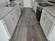 Modern kitchen showcases stylish cabinets, marble countertops, and wood-look flooring at 991 First Dr, Eagle Lake, FL 33839