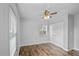 Bedroom with wood-look flooring and a double door closet at 720 S Morrison Ave, Fort Meade, FL 33841