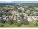 Aerial view of the neighborhood showing homes with mature trees, golf courses, and green spaces at 579 Saint Andrews Rd, Winter Haven, FL 33884