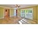 Large bedroom featuring sliding glass doors and a separate bathroom; a beautiful tiled floor throughout at 579 Saint Andrews Rd, Winter Haven, FL 33884