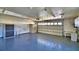 Spacious garage with overhead lighting, storage cabinet, and utility sink at 579 Saint Andrews Rd, Winter Haven, FL 33884