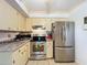 Kitchen featuring stainless steel appliances and ample cabinet space at 579 Saint Andrews Rd, Winter Haven, FL 33884