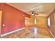 Spacious living room featuring neutral tile floors, a ceiling fan, and unique design elements at 579 Saint Andrews Rd, Winter Haven, FL 33884