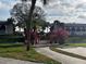 Scenic view of community bridge surrounded by palm trees and lush landscaping at 6001 Country Club Dr, Lake Wales, FL 33898