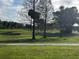 Green space with mature trees in the community at 6001 Country Club Dr, Lake Wales, FL 33898